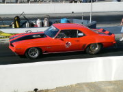 ORANGE 1969 CAMARO WITH BLACK STRIPES